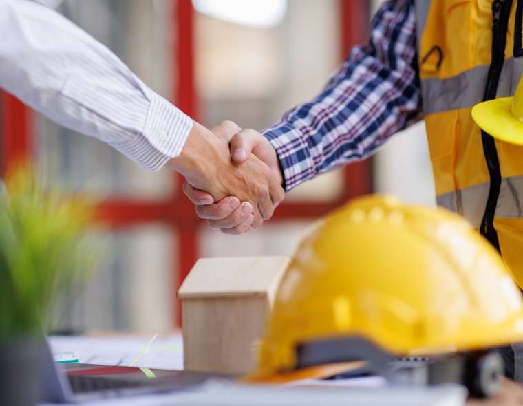 Man shaking hands with a technical sales expert